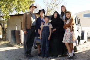 (center) Antonio (Luke Ganalon) and Ultima (Miriam Colon) pose with Antonio's family in "Bless Me Ultima." ©Arenas Group.