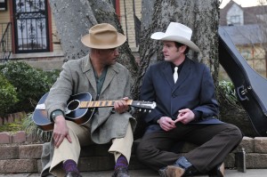 Old friends catch up on the streets of Montgomery, AL. - Lawrence Hamilton (l) and Henry Thomas (r) as HANK WILLIAMS in "THE LAST RIDE [Harry Thomason, Director / James Roberson, Cinematographer] ." ©Live Bait Productions/Mozark Productions. CR: Melody Gaither.