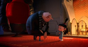 Gru (STEVE CARELL) helps Agnes (ELSIE FISHER) with her Mother's Day speech in "Despicable Me 2." ©Universal Studios.