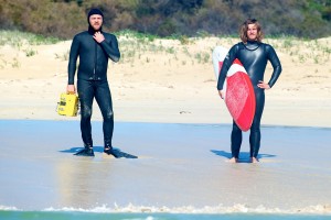 (l-r) JB (Sam Worthington) and Jimmy (Xavier Samuel) wait for big waves to hit the shore before heading out in "Drift." ©Lionsgate Entertainment.
