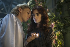 (l-r) Jace (Jamie Campbell Bower) tells (Lily Collins) about his childhood in Screen Gems fantasy-action THE MORTAL INSTRUMENTS: CITY OF BONES. ©Constantin Film International GmbH and Unique Features (TMI) Inc. CR: Rafy.