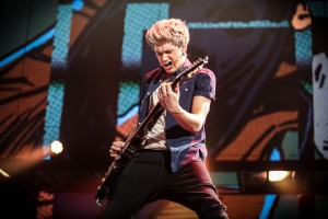 Niall Horan jams on the guitar in TriStar Pictures' "One Direction: This Is Us." ©TriStar Pictures. CR: Christie Goodwin.