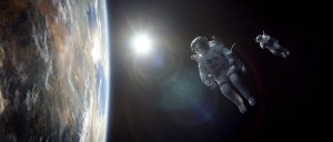 (l-r) George Clooney and Sandra Bullock float in space in "Gravity." ©Warner Bros. Entertainment.