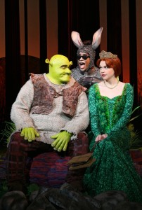 (l-r): Brian d’Arcy James (Shrek), Daniel Breaker (Donkey), & Sutton Foster (Princess Fiona) in "Shrek: The Musical." ©DreamWorks Theatricals. CR: Joan Marcus.