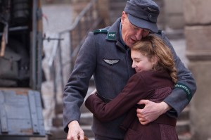 Liesel (Sophie Nélisse) and her foster father Hans (Geoffrey Rush) share a quiet moment in "The Book Thief." ©20th Century Fox. CR: Jules Heath.