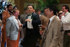 Leonardo DiCaprio (center) is Jordan Belfort in THE WOLF OF WALL STREET. ©Paramount Pictures. CR: Mary Cybulski.