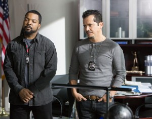 (L to R) James (ICE CUBE) and fellow detective Santiago (JOHN LEGUIZAMO) in "Ride Along." ©Universal Pictures. CR: Quantrell D. Colbert.