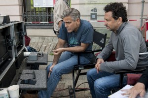 Director/writer/producer George Clooney (left) and producer/writer Grant Heslov on the set of Columbia Pictures' THE MONUMENTS MEN. ©Columbia Pictures. CR: Claudette Barius.