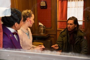 Director WES ANDERSON (right) with TONY REVOLORI and SAOIRSE RONAN on the set of THE GRAND BUDAPEST HOTEL. ©20th Century Fox. CR: Martin Scali.