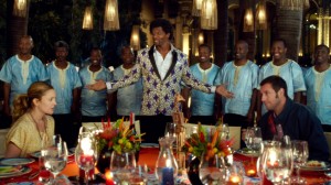 (L-r) DREW BARRYMORE as Lauren, TERRY CREWS as Nickens with backup singers Thathoo played by JUNIOR MAMBAZO and ADAM SANDLER as Jim in BLENDED. ©Warner Bros. Entertainment.