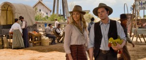 Anna (CHARLIZE THERON) and Albert (SETH MACFARLANE) try not to die at the fair in "A Million Ways to Die in the West." ©Universal Studios.