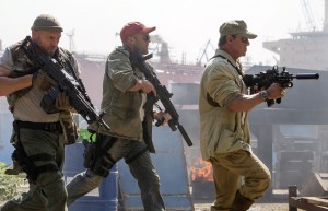 (From left to right) Toll Road (Randy Couture), Lee Christmas (Jason Statham) and Barney Ross (Sylvester Stallone) in THE EXPENDABLES 3. ©lionsgate. CR: Phil Bray.