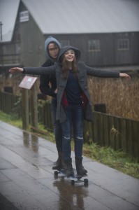 (l-r) JAMIE BLACKLEY as Adam and CHLOE GRACE MORETZ as Mia in IF I STAY. ©Warner Bros. Entertainment. CR: Doane Gregory.