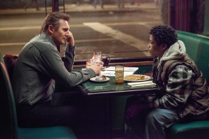 (L to R) Matt Scudder (LIAM NEESON) discusses the case with TJ (BRIAN "ASTRO" BRADLEY) in A WALK AMONG THE TOMBSTONES. ©Universal Pictures. CR: Atsushi Nishijima.