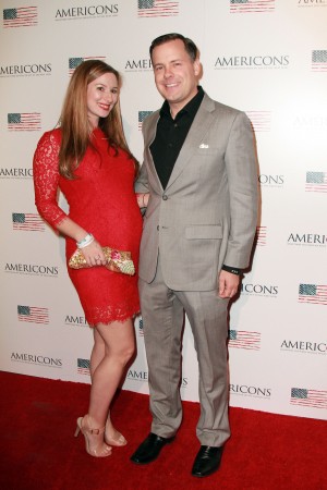Archstone Distribution President & CEO Brady Bowen and wife Brittany Bowen arrives on the red carpet of the premiere of AMERICONS held at the Arclight Theaters in Hollywood, CA on Thursday, January 22, 2015. ©Theresa Bouche