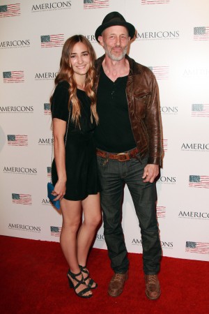 (L-R) Rose McConnell and Jon Gries arrives on the red carpet of the premiere of AMERICONS held at the Arclight Theaters in Hollywood, CA on Thursday, January 22, 2015. ©Theresa Bouche