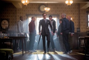 (center) Harry (Colin Firth), an elite member of a top-secret independent intelligence organization known as the Kingsman, prepares to teach some ruffians a lesson in KINGSMEN THE SECRET SERVICE. ©20th Century Fox. CR: Jaap Buitendijk.