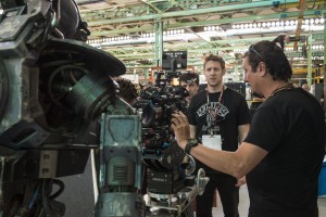 Director Neill Blomkamp (center) on the set of CHAPPIE. ©CTMG. CR: Stephanie Blomkamp.