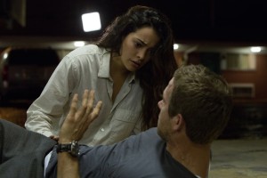 Natalie Martinez (left) stars as Madeline and Ryan Reynolds (right) stars as Young Damian in SELF/LESS. ©Gramercy Pictures. CR: Hilary Bronwyn Gayle.