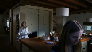 (L to R) Nana (DEANNA DUNAGAN) needs Becca's (OLIVIA DEJONGE) help cleaning the oven in Universal Pictures' THE VISIT. ©Universal Studios.