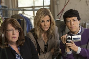 (l-r) Ann Dowd as Nell, Sandra Bullock as Jane Bodine and Reynaldo Pacheco as Eddie in OUR BRAND IS CRISIS. ©Warner Bros. Enertainment/Ratpac-Dune Entertainment. CR: Patti Perret.