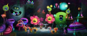 Poppy's (center left with guitar, voiced by Anna Kendrock) rendition of "The Sounds of Silence" reaches its climax as a grumpy Branch (center right, voiced by Justin Timberlake) looks on in DreamWorks Animation's TROLLS. ©DreamWorks Animation.