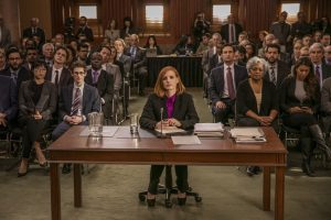 (Front row left to right.) Grace Lynn Jung, Noah Robbins  (Center at desk.) star, Jessica Chastain (Second row  left to right.) Ennis Esmer, Douglas Smith, (Second row fourth to right.) Raoul Bhaneja and (Second row far right.) Sam Waterston star in EuropaCorp's MISS SLOANE. © 2016 EuropaCorp – France 2 Cinema CR: Kerry Hayes